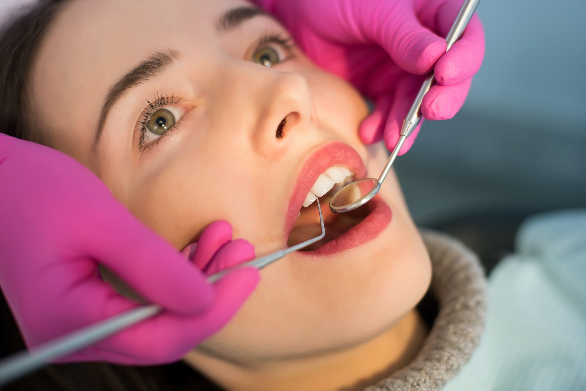 Close up of woman having dental check up in dental office.