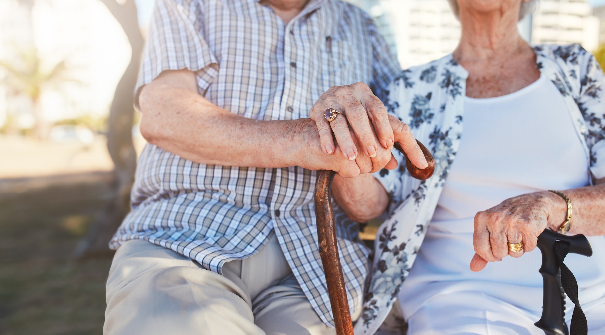 Retired couple holding hands